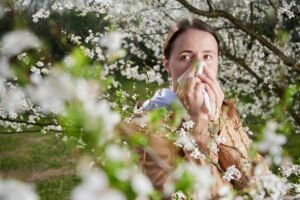 Woman allergic suffering from mold allergy at spring.